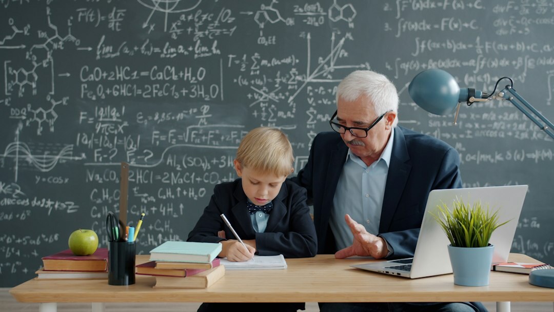 old teacher showing photos