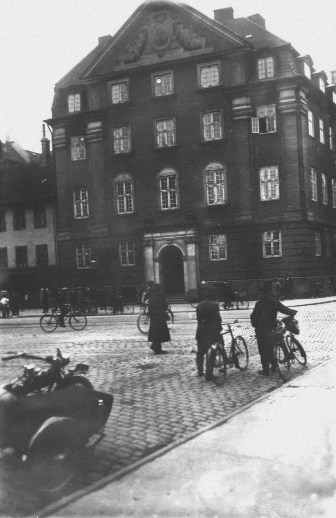 Small group of Danish photographers reviewing prints together